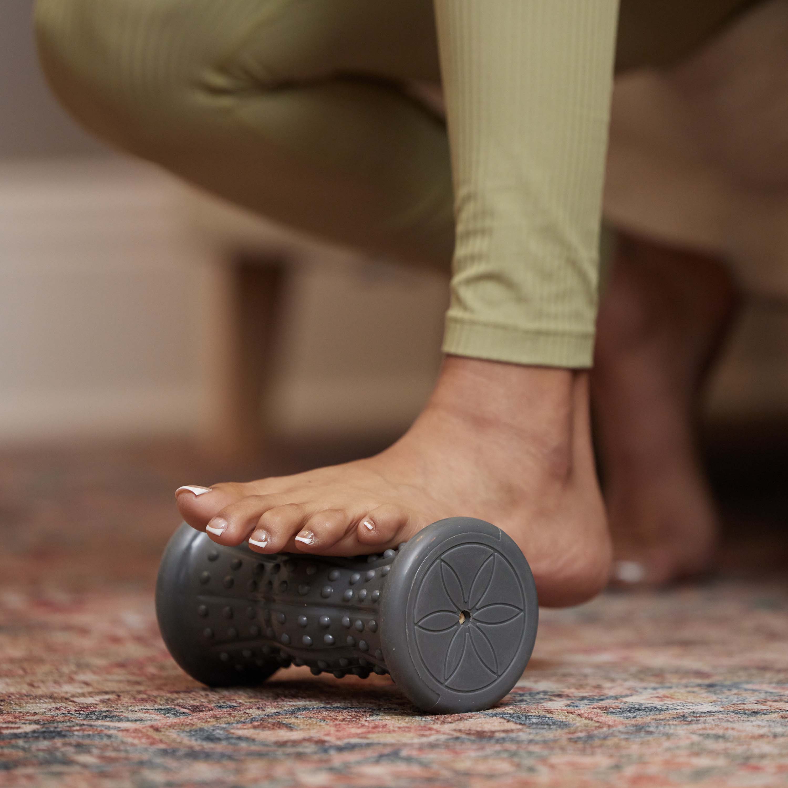 Up close image of persons foot on the Restore Hot & Cold Foot Roller